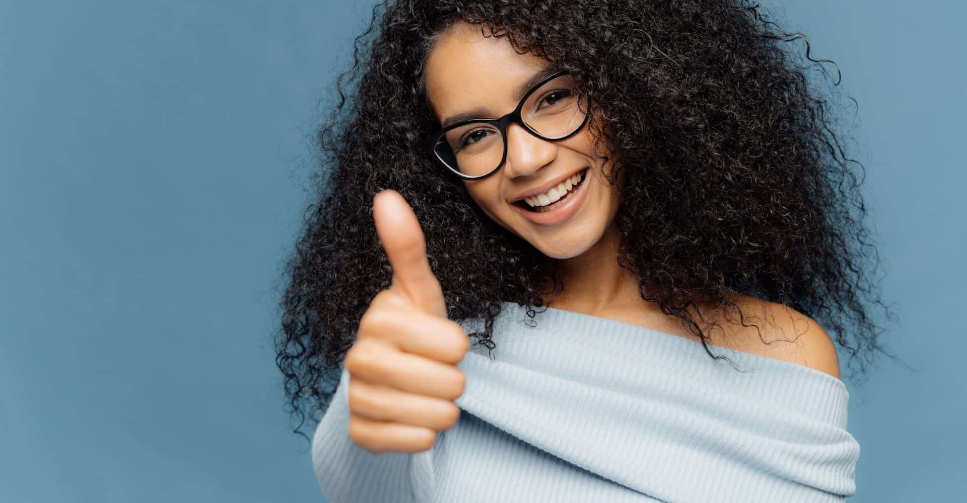 A woman giving a thumbs up