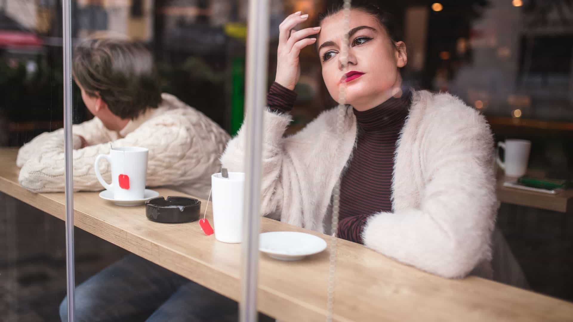 A distraught couple at a coffee shop